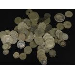 A quantity of mainly British and foreign commemorative white metal coins, to include a 1935 George V