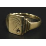 A 9ct gold signet ring, with ray type design, 4.1g all in