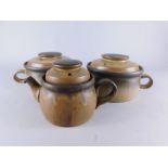 A large quantity of Denby brown glazed tea and dinner ware, to include various tureens and covers