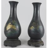 A pair of oriental lacquer style vases, decorated with river landscape, boats etc.