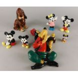 A collection of Disney related items, to include a seated hound, Mickey & Minnie Mouse figures and a