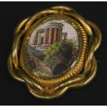 A 19thC and later micromosaic style brooch, inset with a print of an Italianate building