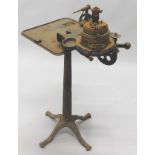 A late 19thC Harrison patent knitting machine, made in Manchester, with ebonised cast iron column