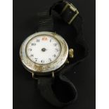 A silver and enamel wristwatch, the watch head, with rubbed enamel work, on black material strap.