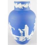 An Adams Jasperware vase, decorated in the Wedgwood style with Neo-Classical figures, band of grapes