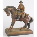 A late 19th/early 20thC cold painted spelter figure of a highwayman, possibly Dick Turpin, on a