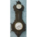 A late 19thC French cast iron clock and aneroid barometer, the case decorated with leaves etc. (AF),