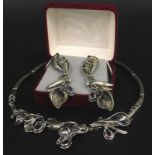 An Art Nouveau style silver plated necklace and earring set, set with purple stones (2)