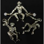 A mid 20thC monkey brooch, with seated monkey and two dangling monkeys, each stone set with white