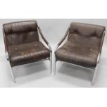 A pair of retro style brown leather and chrome plated low open armchairs. The upholstery in this lot