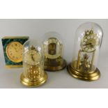 A collection of anniversary type clocks, to include a battery operated example under a dome, a