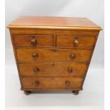 A Victorian mahogany chest of drawers, the top with a moulded edge, above two short and three long