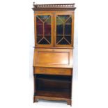 A Maple & Co Edwardian mahogany and satinwood crossbanded bureau bookcase, the top with a pierced