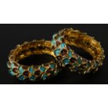 A pair of gilt and enamel costume bracelets, each stamped Boucher to the interior.