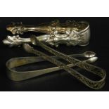 Three sets of Continental silver coloured metal sugar tongs, to include an example with bright cut