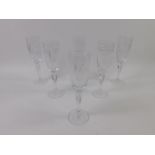 A set of six Waterford cut glass champagne flutes decorated in the Marquis pattern.