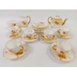 A Royal Doulton early 20thC blush porcelain part tea service, printed with meadow flowers,