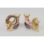 A pair of Royal Crown Derby porcelain Imari candle holders, modelled as the Lion and Unicorn,