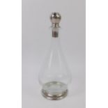 A French 20thC cut glass and pewter mounted decanter and stopper, of pear form, impressed marks,