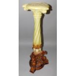 A Leeds Art Pottery Ltd late 19thC green and brown pottery jardiniere stand, of wrythe column form