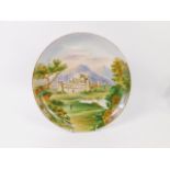 A late 19thC pottery wall plate painted with Inveraray Castle, titled, 31cm diameter.