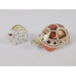 A Royal Crown Derby porcelain Imari paperweight modelled as a Tortoise, and another of a baby