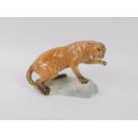 A Beswick pottery figure of a Puma, modelled on a naturalistic ground, No 1823, impressed marks.