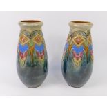 A pair of Royal Doulton late 19thC stoneware vases, of tear drop form tube line decorated with