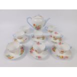 A Shelley porcelain mid 20thC porcelain part coffee service, printed with floral sprays, printed