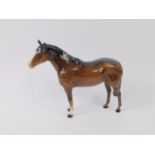 A Beswick brown gloss horse, printed mark, 24cm long.