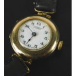 An A Corbett wristwatch, with circular watch head, with white enamel dial, and black hands, with