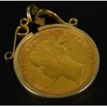 A Victorian full gold sovereign pendant, dated 1877, in a 9ct gold pendant frame, (AF), 9.8g all in.