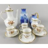 A Royal Copenhagen porcelain part coffee service, decorated in shades of brown and gilt with