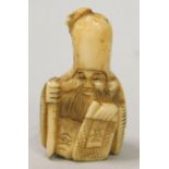 An early 20thC Japanese ivory netsuke, carved in the form of an immortal (AF)