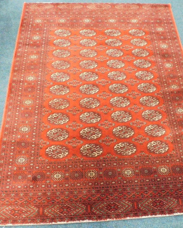 Withdrawn pre sale by vendor. A modern Keshan wool carpet, decorated with four rows of medallions