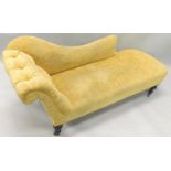 A Victorian chaise longue, re-upholstered in gold striped fabric on turned legs with castors