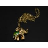 A 9ct gold elephant pendant and chain, the elephant shaped pendant with green and turquoise coloured