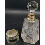 Two small silver mounted items, dressing table jar with lid, embossed with flowers etc. and a