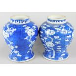 A pair of late 19thC Chinese prunus pattern baluster vases, lacking covers, 23cm high