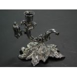 A Victorian silver chamberstick, with scroll shaped sconce and leaf cast base, Sheffield 1847 and