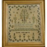 An early 19thC wall work sampler, embroidered with a scene of Adam and Eve, the Tree of Life,