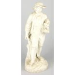 A 19th Continental parian figure, modelled in the form of a woodsman on circular base, 35cm high.