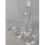 A late 20thC Scandinavian Orrefors glass decanter and stopper, and six similar tumblers