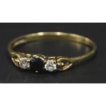 A dress ring, set with blue and white stones, with pierced shoulders, yellow metal, hallmarks