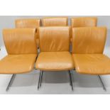 A set of six Zanuso style tan coloured leather and chrome dining chairs, each with a padded back