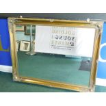 A rectangular gilt wall mirror, with bevelled plate, 94cm x 117cm