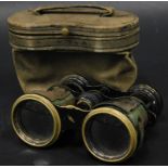 A pair of early 20thC blackened brass opera glasses, stamped Strand London in leather case