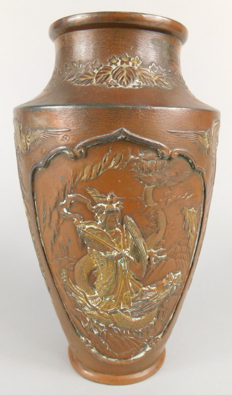 A Japanese bronzed spelter vase, with Meiji type decoration of landscapes, exotic birds, figures,