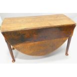 An 18thC oak drop oval drop leaf table, on pad feet, 120cm wide