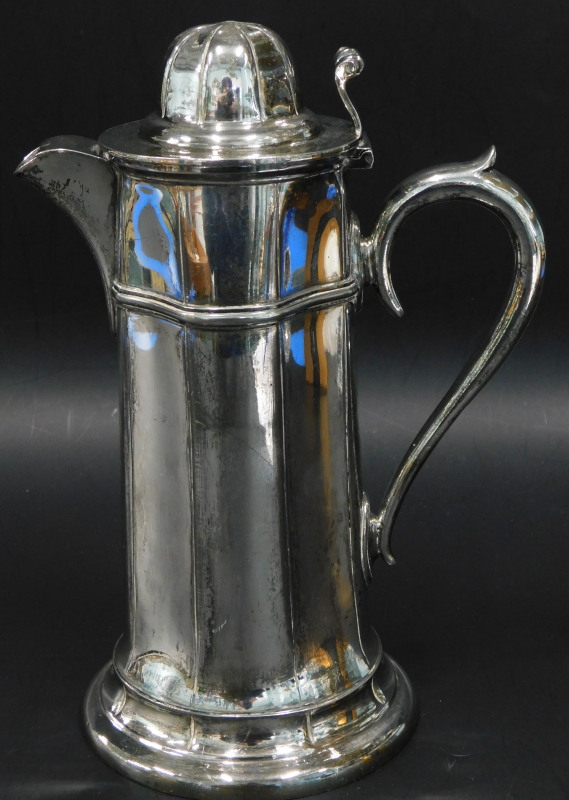 A Victorian ecclesiastical style lidded flagon, with tapering sides, scroll cast handle, 25cm high